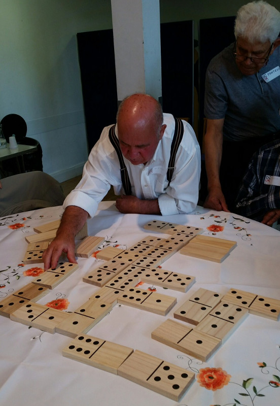 Alfonso playing dominoes at Sha'arei Tsedek in a Dementia Club UK session Alfonso playing dominoes at Sha'arei Tsedek in a Dementia Club UK session