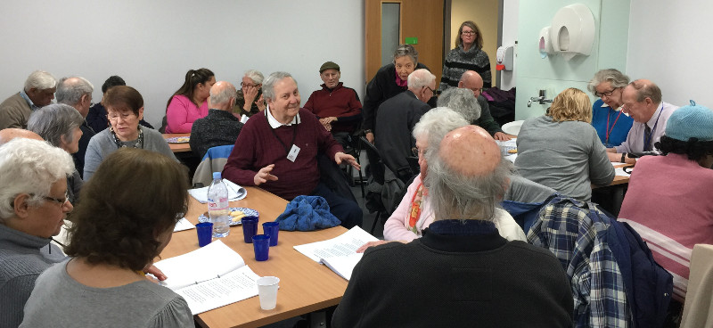 Members of Dementia Club UK cotentrating on their song sheets Members of Dementia Club UK conentrating on their song sheets