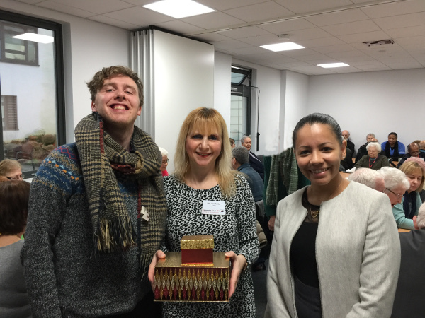 Steven and Juliana from Carlton Court Care Home with Lisa holding a box of home made cookies Steven and Juliana from Carlton Court Care Home with Lisa holding a box of home made cookies