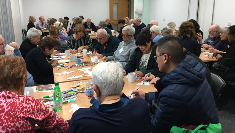 Members of Dementia Club UK busy colouring in figures for the banner Members of Dementia Club UK busy colouring in figures for the banner