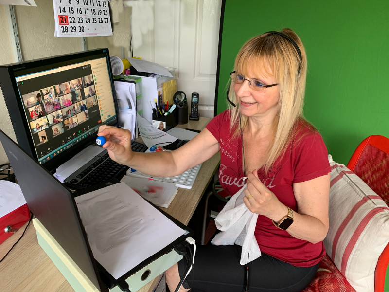 Lisa with green screen playing virtual Bingo Lisa with green screen playing virtual Bingo