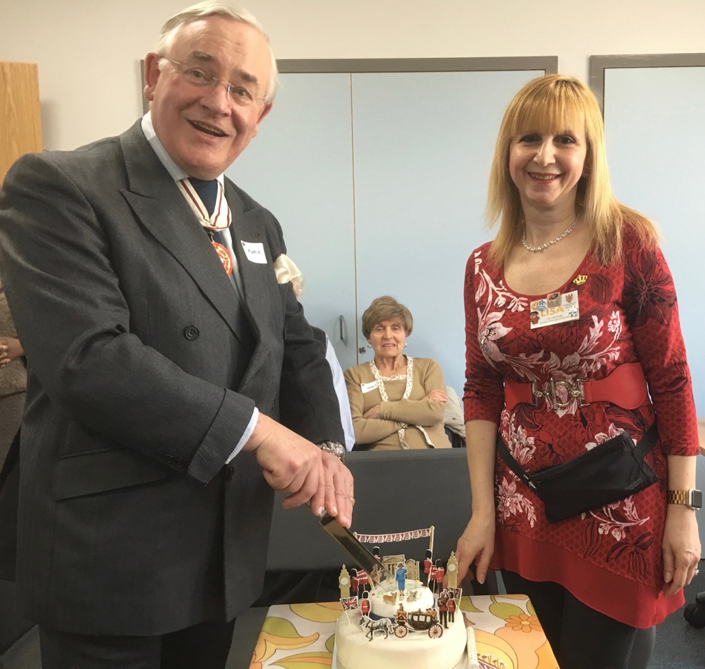 Martin Russell DL cutting a birthday cake to celebrate HM the Queens 90th Birthday