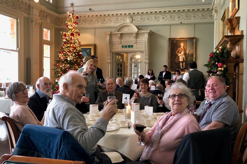 Members in the 'Long Room' listening to carol singers and enjoying their tea. Members in the 'Long Room' listening to carol singers and enjoying their tea.