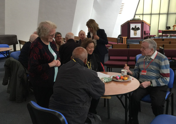 Members concentrating on the quiz with a cake and tea. Members concentrating on the quiz with a cake and tea.