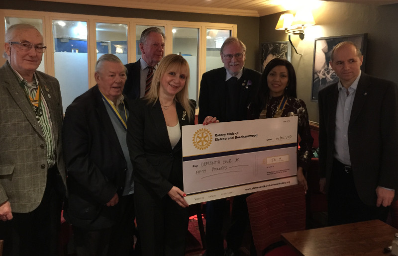 Members of the Rotary Club of Elstree & Borehamwood donating a cheque to Lisa chairman of Dementia Club UK Members of the Rotary Club of Elstree & Borehamwood donating a cheque to Lisa chairman of Dementia Club UK