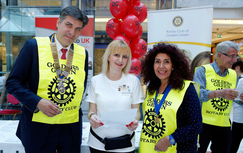 Volunteers and partners at the Rotary Club of Golders Green, President Martin Schramm, Founder and Chairman of Dementia Club UK Lisa Rutter, Valerie Chodosh & Geoff in the background Volunteers and partners at the Rotary Club of Golders Green, President Martin Schramm, Founder and Chairman of Dementia Club UK Lisa Rutter, Valerie Chodosh & Geoff in the background